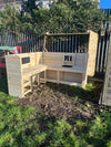 Large L- shaped mud kitchen